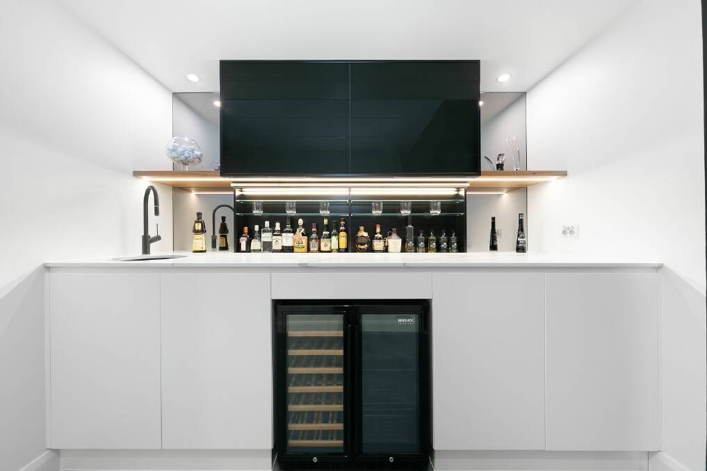 The downstairs entertaining area has a pop-up automated bar. Picture supplied
