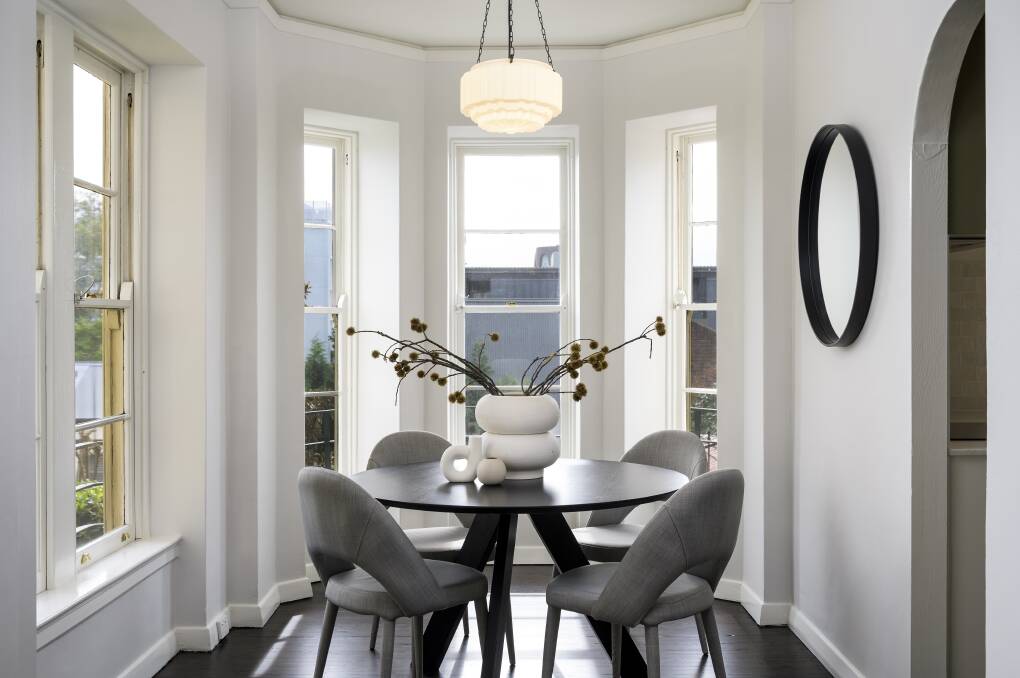 The apartment's card room is utilised as a dining space.
