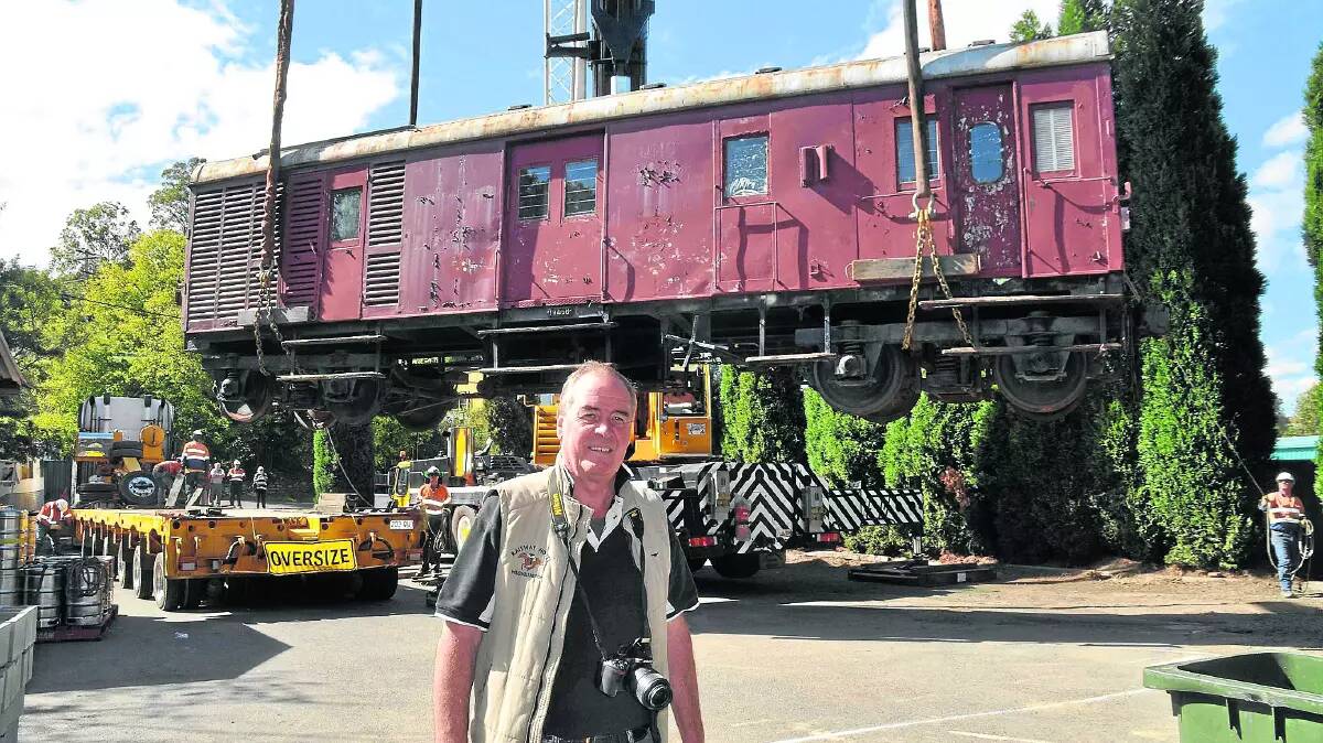 The Railway Hotel owner Greg Smith with the rail carriage which is used as a bar in the hotel's beer garden. Picture supplied