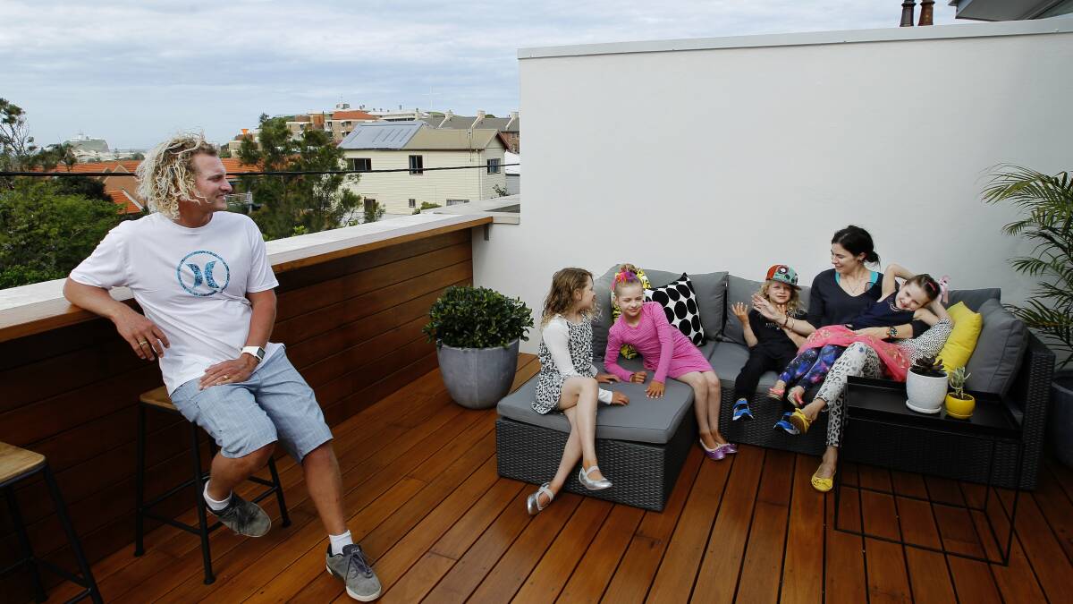 Former olympian Justin Norris and his family pictured at their Newcastle East home in 2015. Picture by Max Mason-Hubers.
