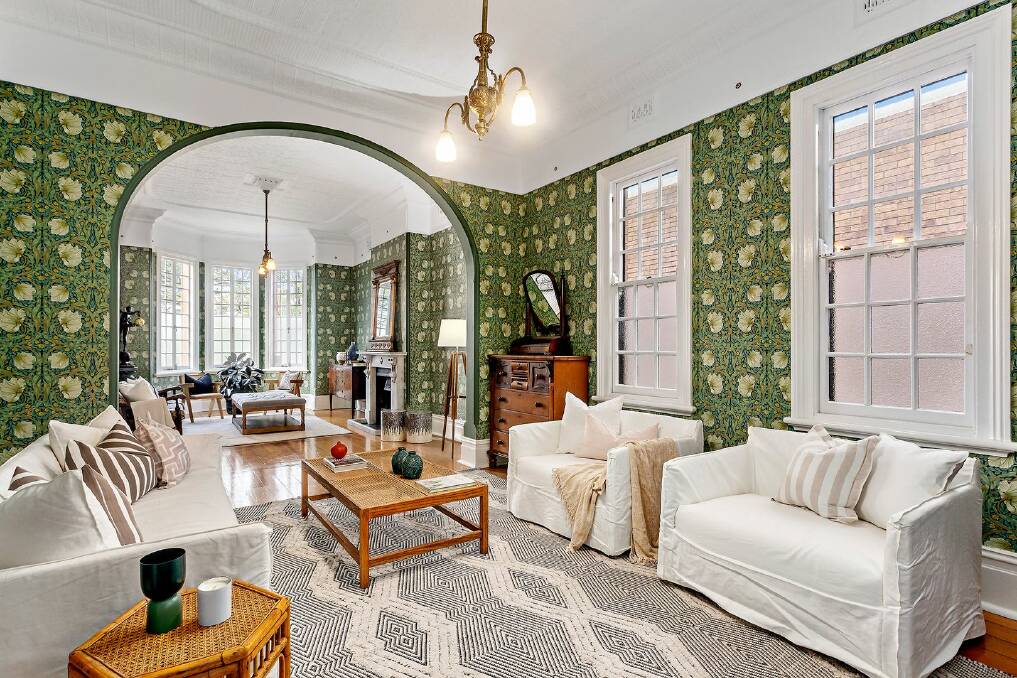 The formal living room has high ornate ceilings and decorative William Morris wallpaper. Picture supplied