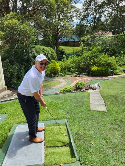 Colliers Residential Newcastle listing agent Anthony Merlo takes a shot on the chipping green. Picture supplied