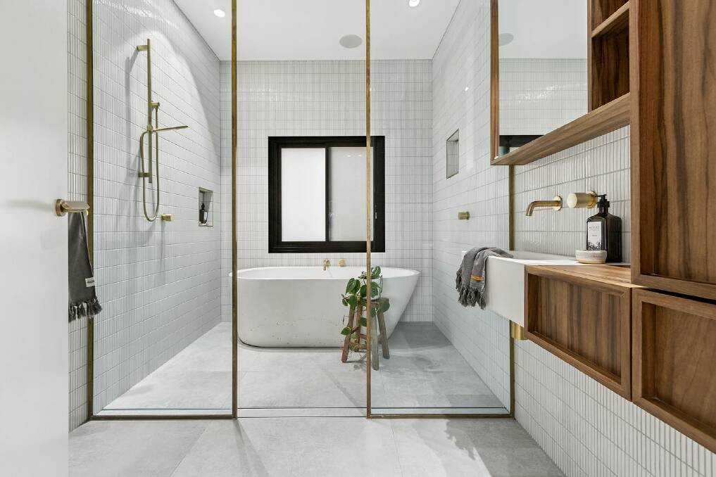 The home's bathrooms feature concrete basins, including two with freestanding concrete baths.