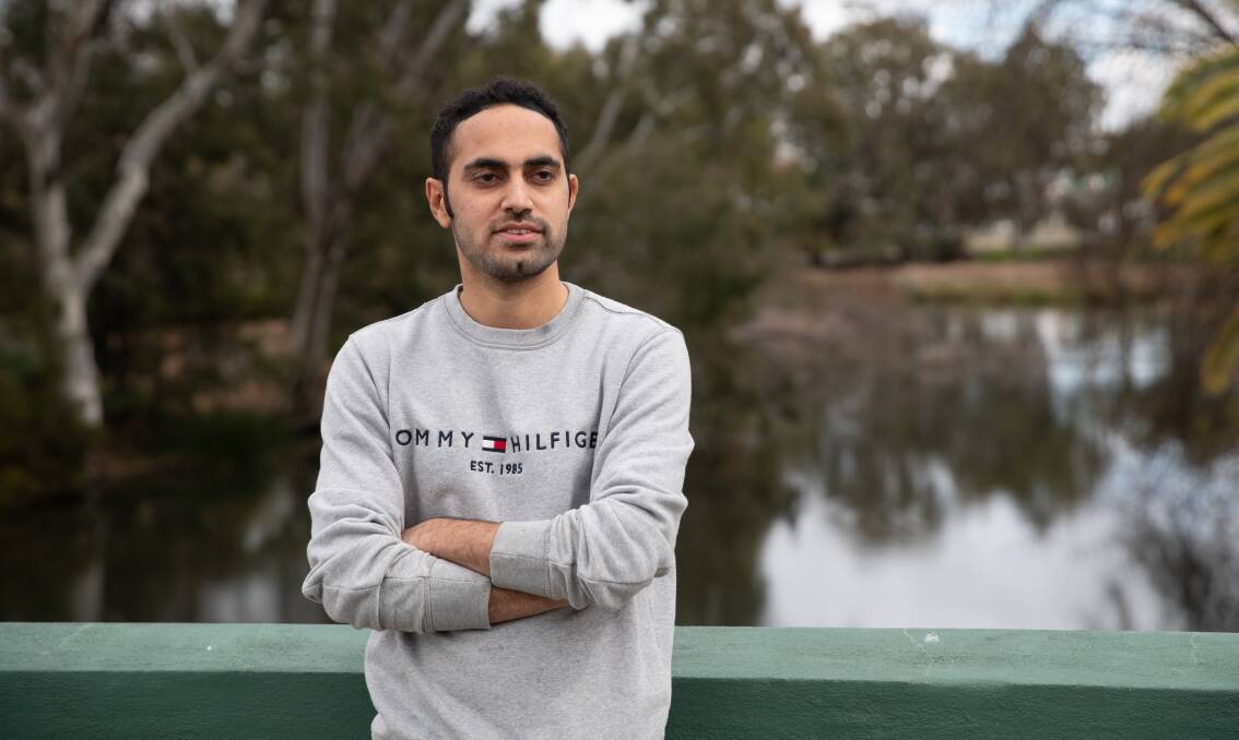 If you saw Ali Hamza stacking shelves at Woolworths in NSW's Riverina, you might not know he's a qualified and experienced mechanical engineer struggling to find work in his field. Picture by Madeline Begley 