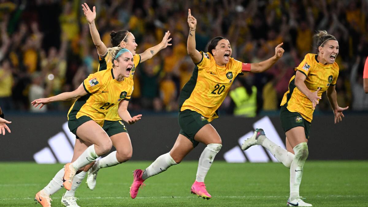 Ellie Carpenter, Caitlin Foord, Sam Kerr and Steph Catley of Australia celebrate after Cortnee Vine kicked a successful penalty goal to score the Matildas place in the semi-final. (AAP Image/Darren England)