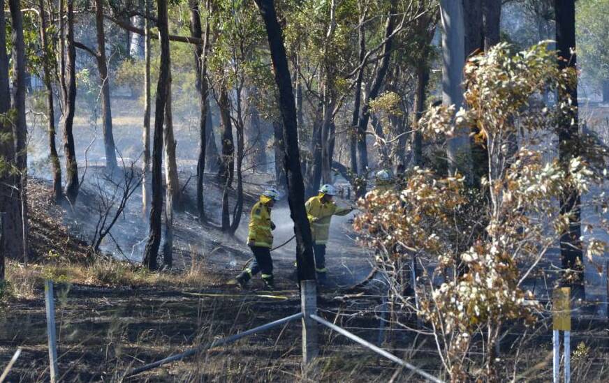 Mid North Coast RFS crews mop-up after a grassfire. File picture by Emily Walker