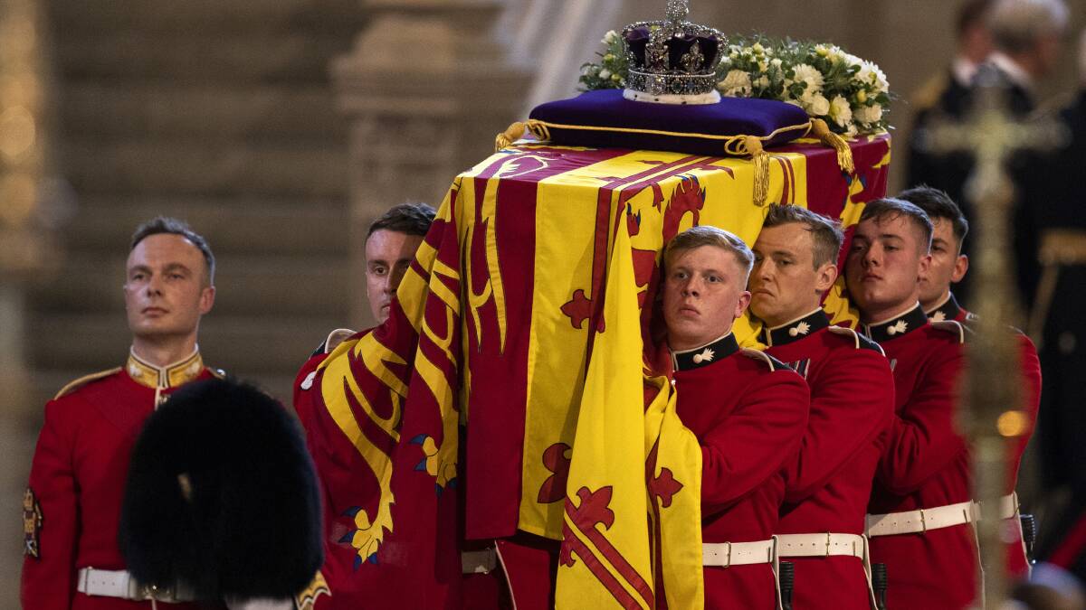 The Imperial State Crown is seen on the coffin carrying Queen Elizabeth II into Westminster Hall for the Lying in State at the Palace of Westminster in London. Picture by Dan Kitwood/Pool via AP
