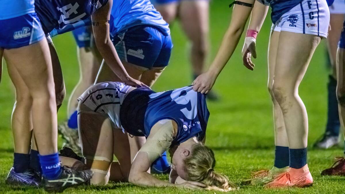 Wynyard's Emma Humphries gets dumped in a tackle in the NWFL women's preliminary final. Picture by Simon Sturzaker