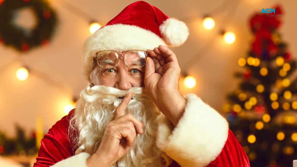 Man dressed as Santa Claus hushes viewers. File picture.