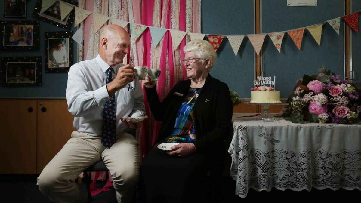 Sister Pat Davidson celebrated her 80th birthday surrounded by her "family" of teachers at St Paul's Primary School, including principal Greg Cumming. Picture by Simone De Peak
