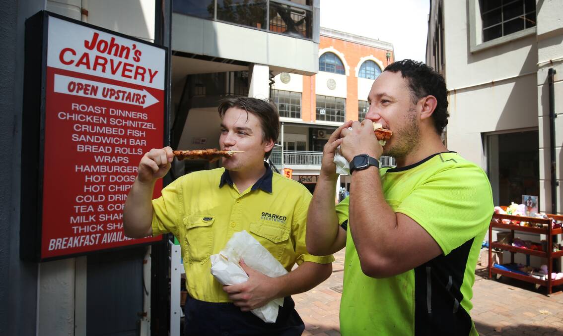 'I always order a BLT wrap and some chicken strips.' From left: Ross Howard and Shaun Simpson tuck into a last lunch at their favourite location. Picture by Simone De Peak 