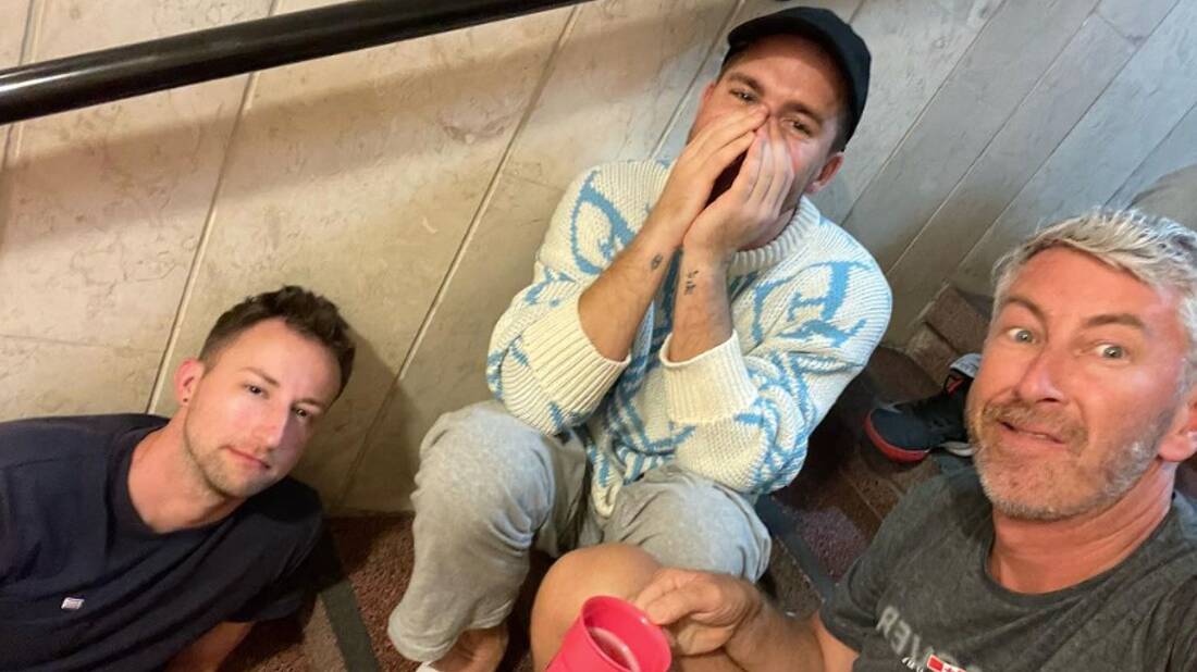 Australian actor Hugh Sheridan (middle) shelters in a hotel staircase in Tel Aviv, Israel. Picture by @davidanthonydraper