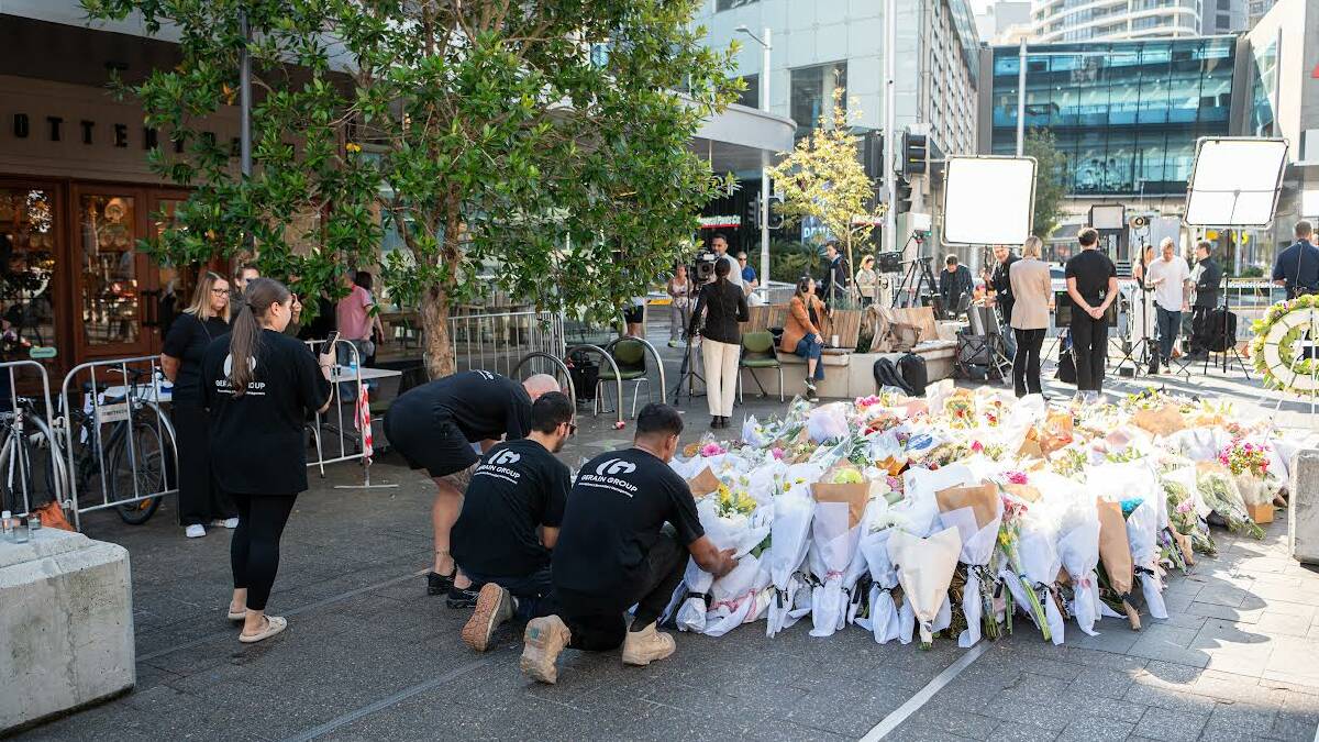 A makeshift memorial outside the Westfield Bondi Junction shopping centre in tribute to the victims of the Bondi Junction stabbing spree. Picture: AAP Image/Flavio Brancaleone