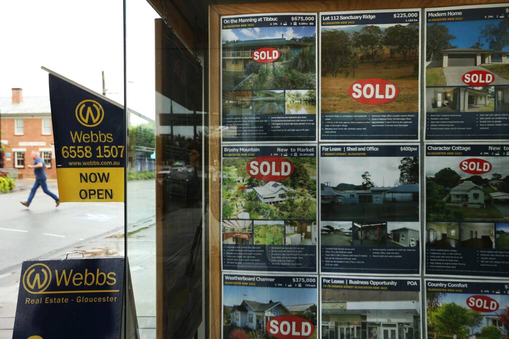 Sign of the times: Sold stickers in the window at Webb Real Estate in Gloucester. Picture: Simone De Peak