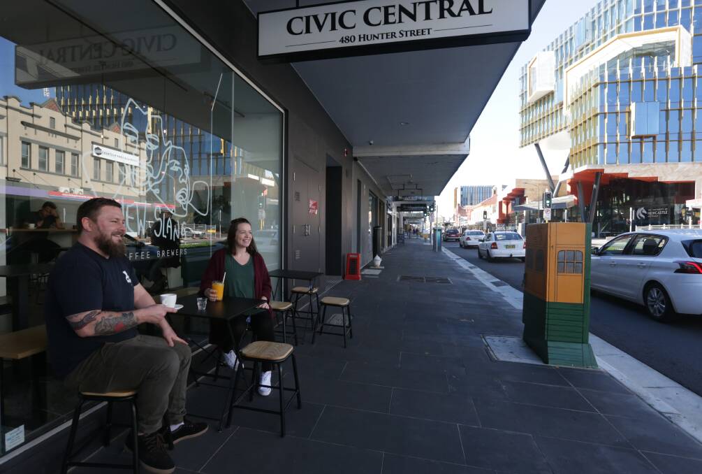 New Slang: Alaric Daley and his partner Sara outside their new cafe on Hunter Street. Picture: Simone De Peak