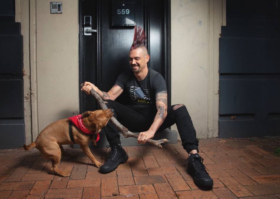 A very good year: Artist and podcaster Damien Linnane with his dog, Izzy. Picture: Marina Neil
