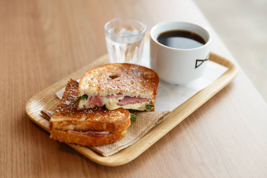 Coming at you: Coffee, sparkling water and a toastie at Mr Sister at Speers Point. Picture: Max Mason-Hubers