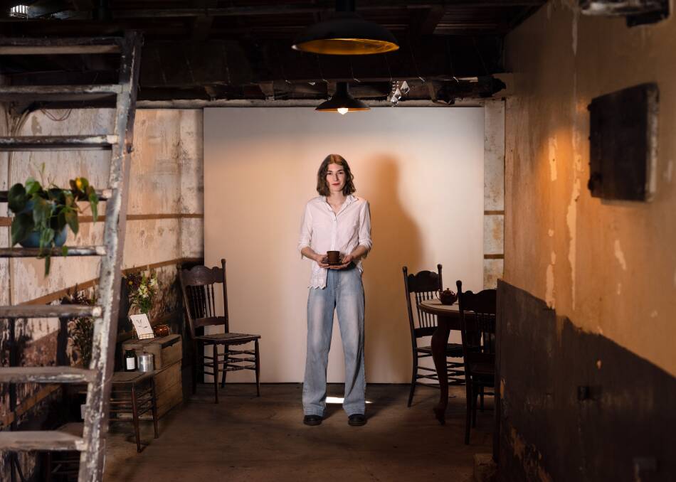 Grace Barnes started the Maitland Street Collective after her parents restored The Commercial Hotel in Singleton (where she is photographed, in the cellar, and where her business is based). She has recently opened a gallery in the space. Picture by Edwina Richards