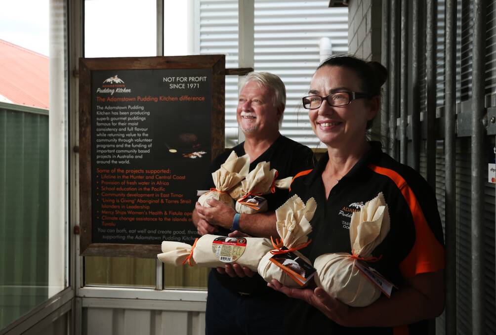 Pudding time: Adamstown Uniting Church Reverend Rod Pattenden and Pudding Kitchen manager Janet Newton. Picture: Simone De Peak