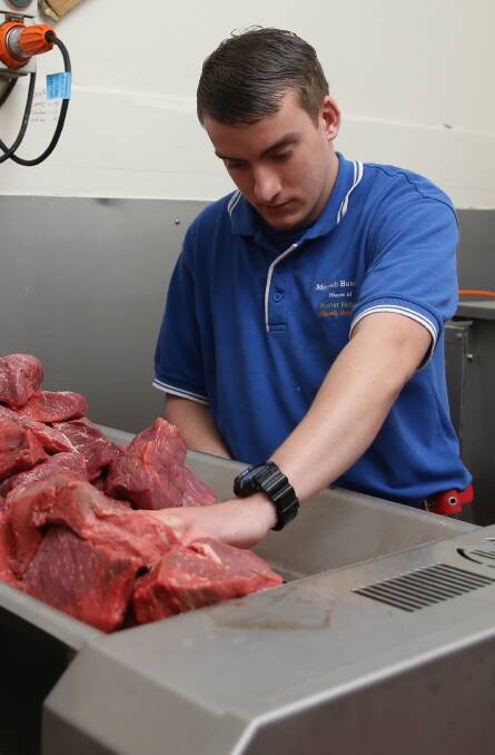 Dicing beef: Caleb Hamson at Morpeth Butchery. Picture: Jonathan Carroll