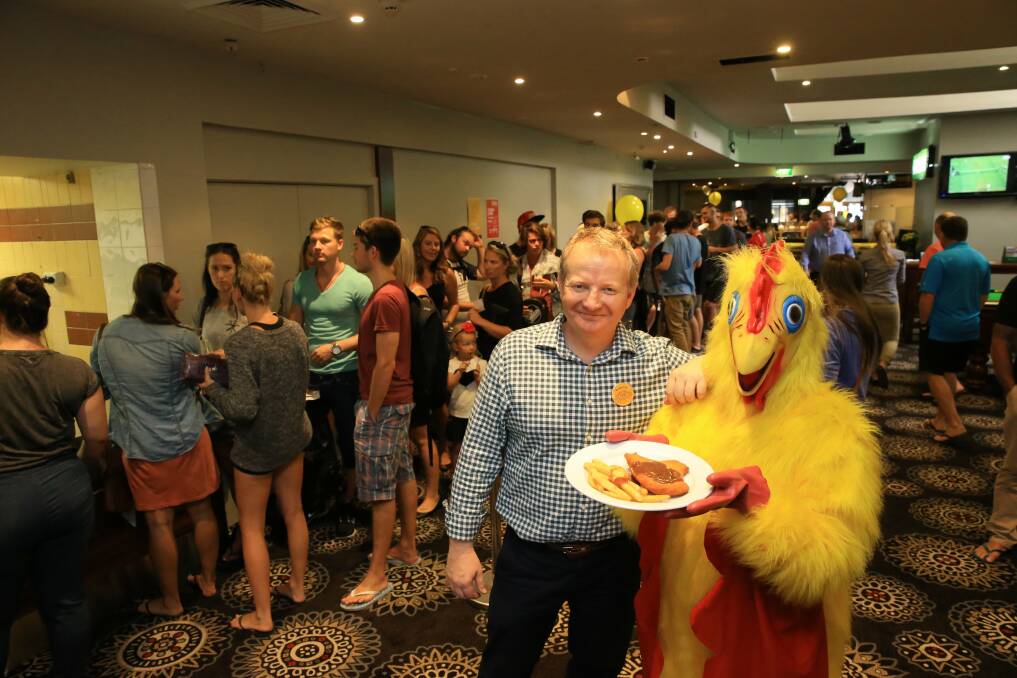 Quick improver: Hunt in March 2014 with Shannon the Chook during a promotion at the CBD Hotel he owned, giving away free schnitzel all day to break the record for most eaten in a day (Picture by Dean Osland).