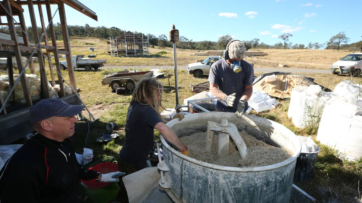 Communal: people working with Hempcrete a wall material being used on a home at Shepherds Ground in 2017. Picture: Simone De Peak