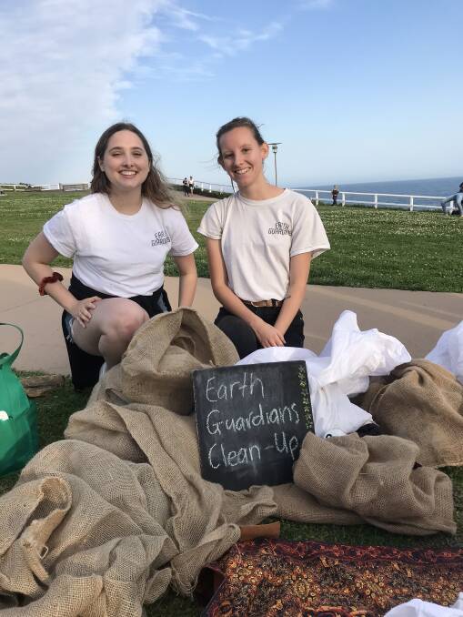 Every bit helps: Ruby Maughan and Mikayla Crossley of Earth Guardians Newcastle. Picture: Anna Falkenmire