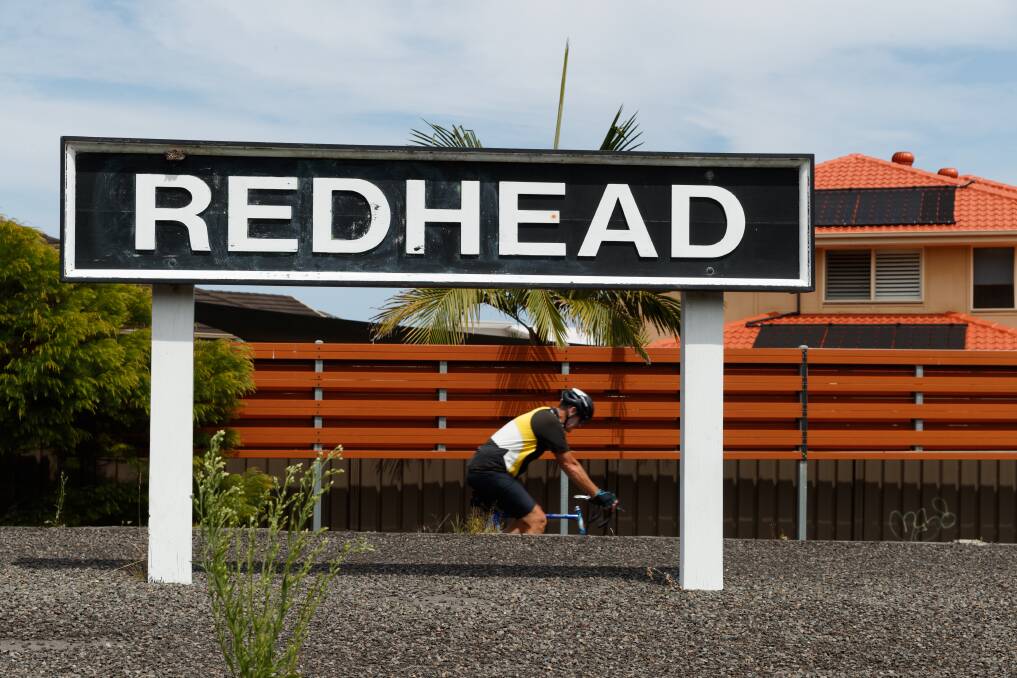 Piece of history: A cyclist passing the former Redhead railway station. Picture: Max Mason-Hubers