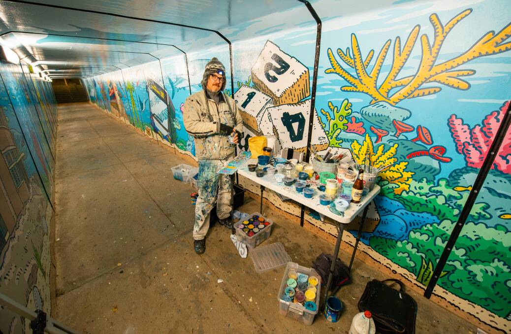 800 hours of hard labor: Trevor Dickinson during the making of The Amazing Merewether Aquarium mural. Picture: Martyn Taylor
