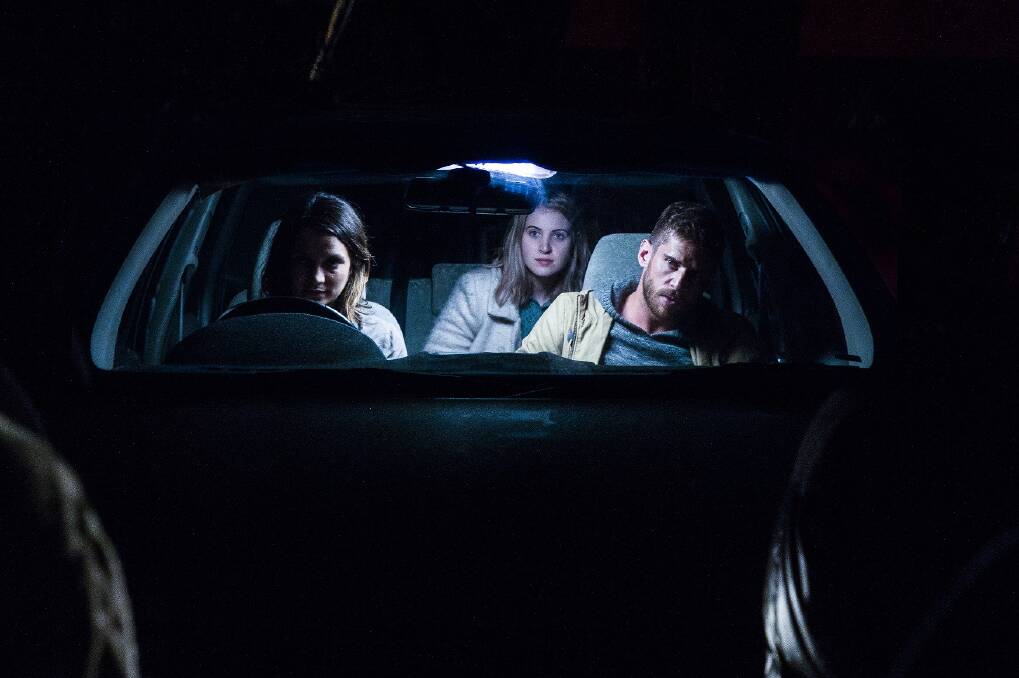 Beast No More: Jessica Tovey, Taya Calder-Mason and Dan Ewing in a scene from the horror film, which premieres on November 2 in Sydney. Picture: Dan Berghofer
