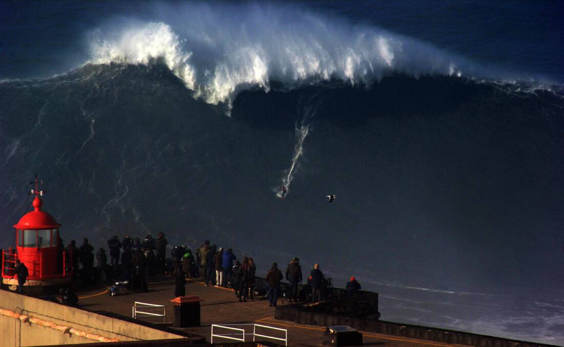 Wave chaser: Ross Clarke-Jones riding Big Mama in Nazare, Portugal. Picture: Nac Coc