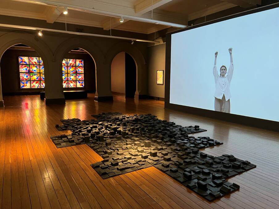 Brett McMahon's installation Colony on the floor, Lottie Consalvo video on near wall, and artwork by Ken O'Regan on far wall.