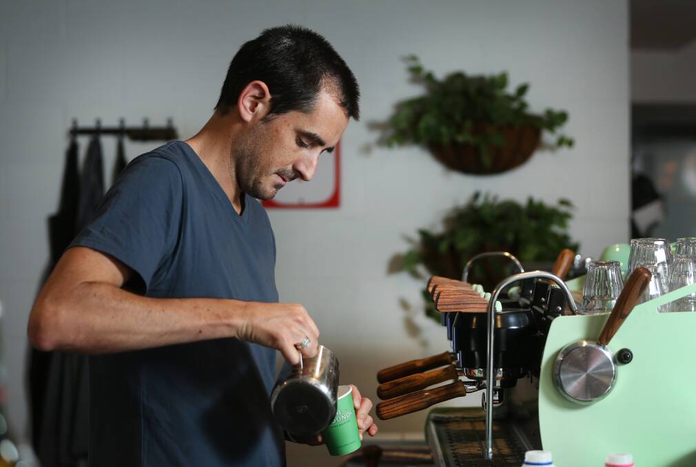 The Grounds: Owner and barista Zach Levien at Bolton Street Pantry pours a serious coffee. Picture: Marina Neil