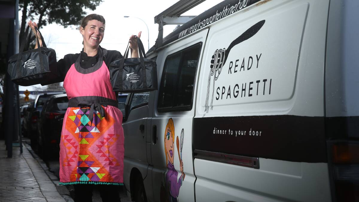 Ready to go: Tory Peters with some of her meals and her delivery van.