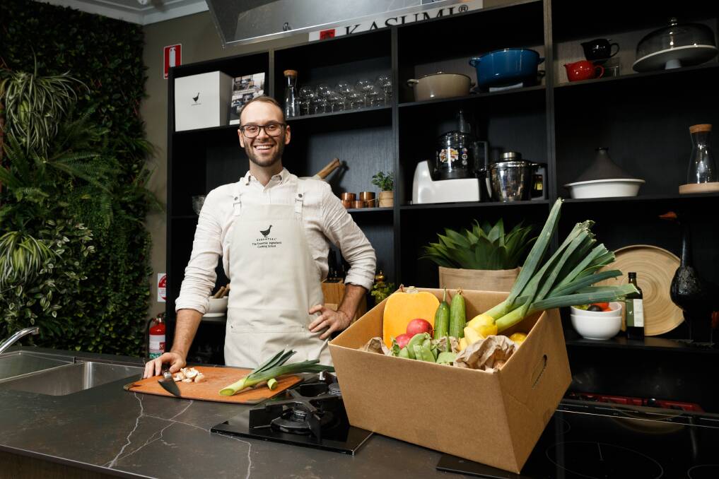 Hands-on: Reece Hignell with a box of goodies used in his cooking classes. Picture: Max Mason-Hubers