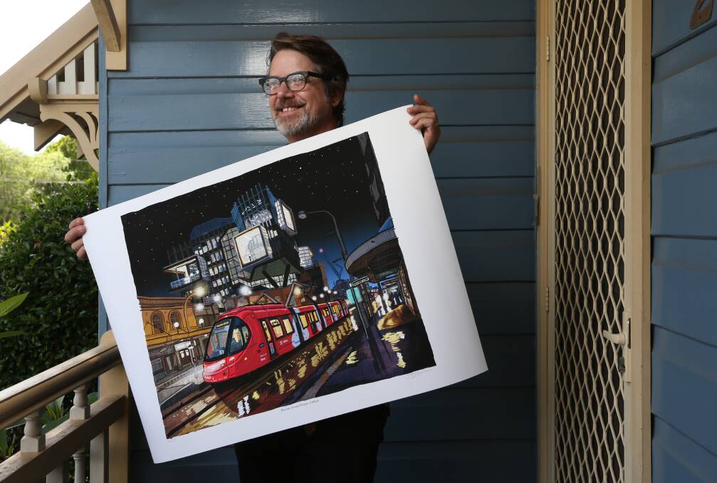 Hello Newcastle: Trevor Dickinson with a print of the image that appears in The Book of Newcastle. Pictures: Simone De Peak