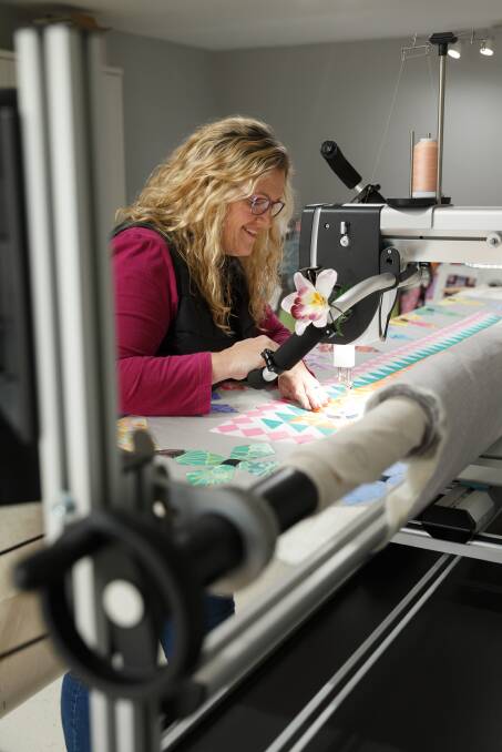 Dedicated: Leanne Harvey at work at her longarm machine. Picture: Max Mason-Hubers