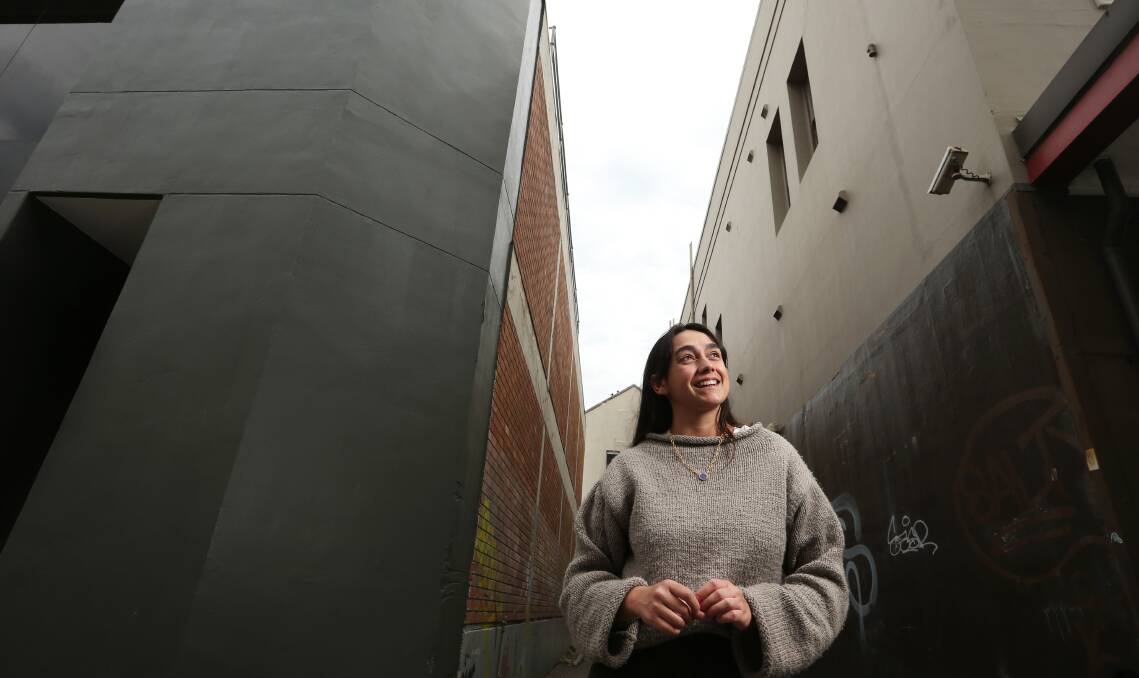 New challenges: Jasmine Craciun at the site for her mural at The Big Picture Festival this weekend. Picture: Simone De Peak