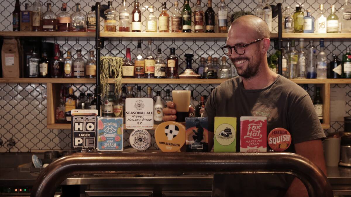 Easy does it: Happy Wombat owner Luke Tilse on the taps, which include Tilse's Apple Truck Cider from the family orchard in the Barringtons.
