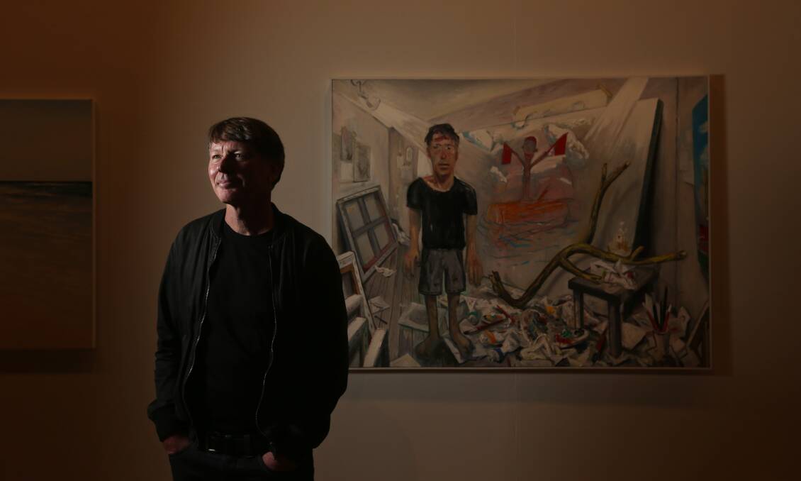 The winner: Michael Bell stands beside his Kilgour Prize-winning self portrait at the Newcastle Gallery. Pictures: Simone De Peak 