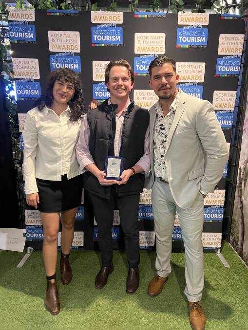 It was a lucky night for Alexander Crelley, centre, of Hunt Hospitality, a finalist for Employee of the Year at the Newcastle tourism awards. Crelley, with Luisa Amosa and Nick Gorgichuk, won the draw for four nights in Melbourne.