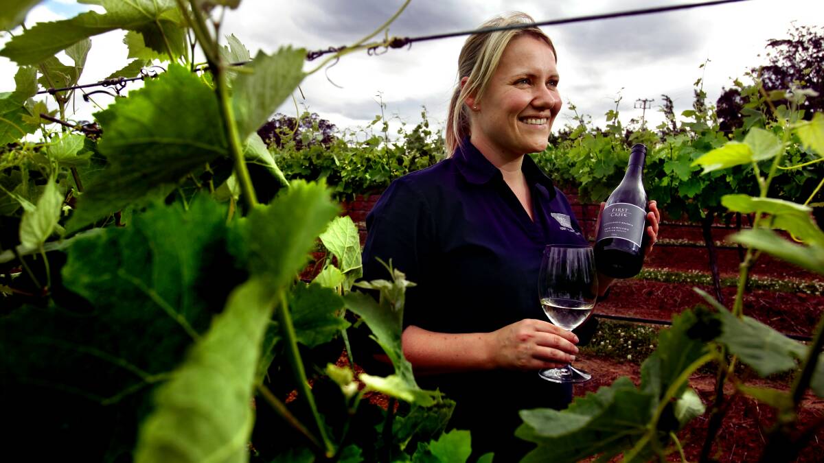 WINNER FROM THE START: Liz Silkman, age 32, with a semillon that won a trophy for Best Mature Dry White at this year's NSW Wine Awards, October 2010. Picture: Simone De Peak