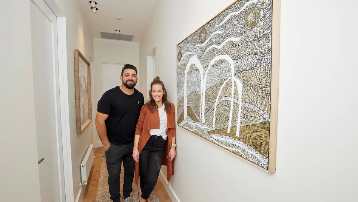 A winner: Ronnie and Georgia on The Block with one of their Lizzy Stageman paintings, Galingbangbur(Meaning Children), which is a hot seller on The Block Shop online. 