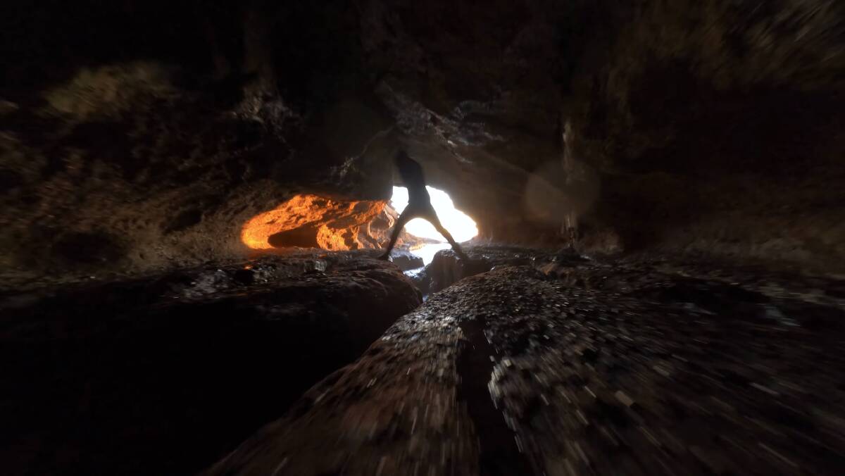Daybreak from a cave: A screen shot from one of Clifford Wakeman's drone videos.