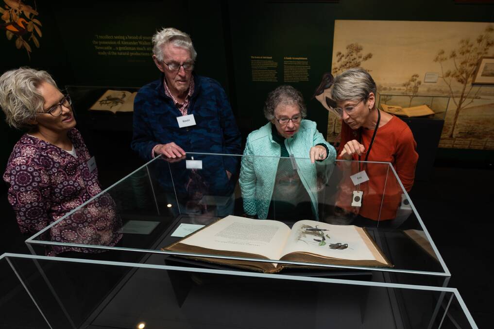 Music therapist Susan Ashley-Brown, Keven and Catherine Claydon, and Kay Pisel discuss some of the Memory Room's displays. Picture by Jonathan Carroll