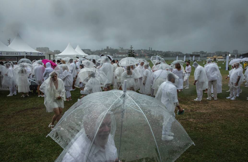 Rain and wind hit the Stockton location of Diner en Blanc at nearly the same time as 1200 guests arrived on site. Picture by Marina Neil
