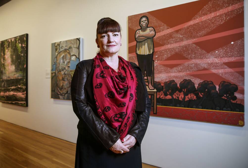Show goes on: Newcastle Art Gallery director Lauretta Morton with 2019 Kilgour Art Prize winning work, 'Queen of her own stage. Ms Ursula Yovich', by Blak Douglas.