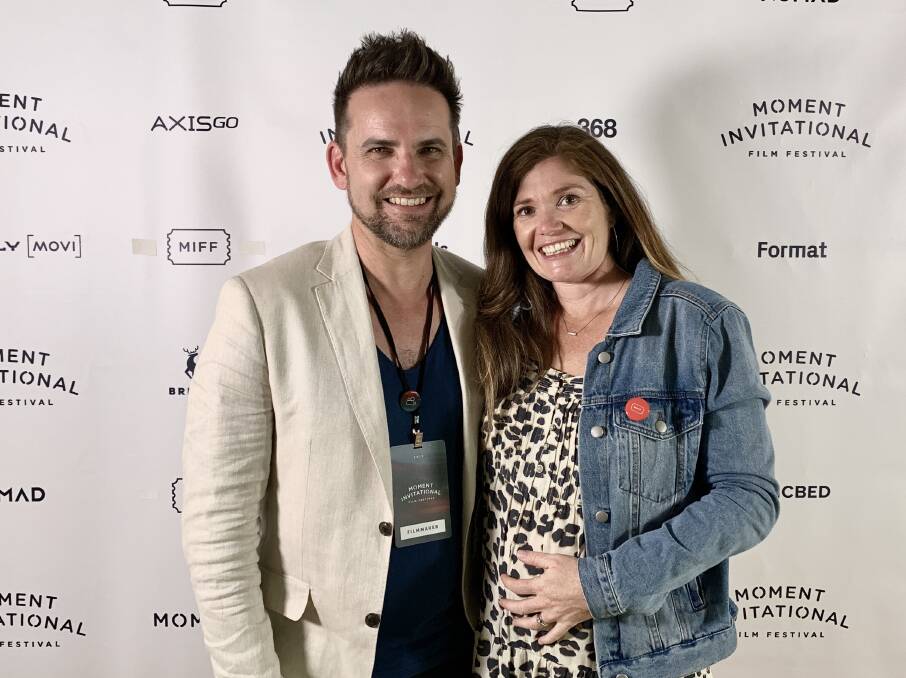 Happy: Jason van Genderen in New York last week at the Moment Invitational Film Festival with his wife, Megan, 31 weeks pregnant.