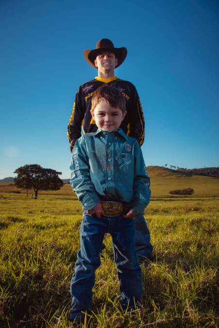 On top of the world: Melville stockman Mitch Russell and his son, Max 4, a cowboy in the making. Picture: Simon McCarthy