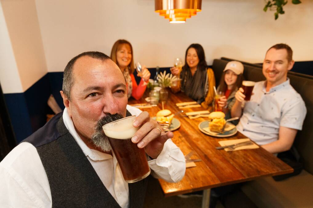 Cheers to that: Thomas Delgatto of Waratah enjoying the first sip of beer at Happy Wombat last week while Libby and daughter Emma and her husband Brendan Clarke of Kotarah South and daughter Lucia Hancock watch on. Picture: Max Mason-Hubers